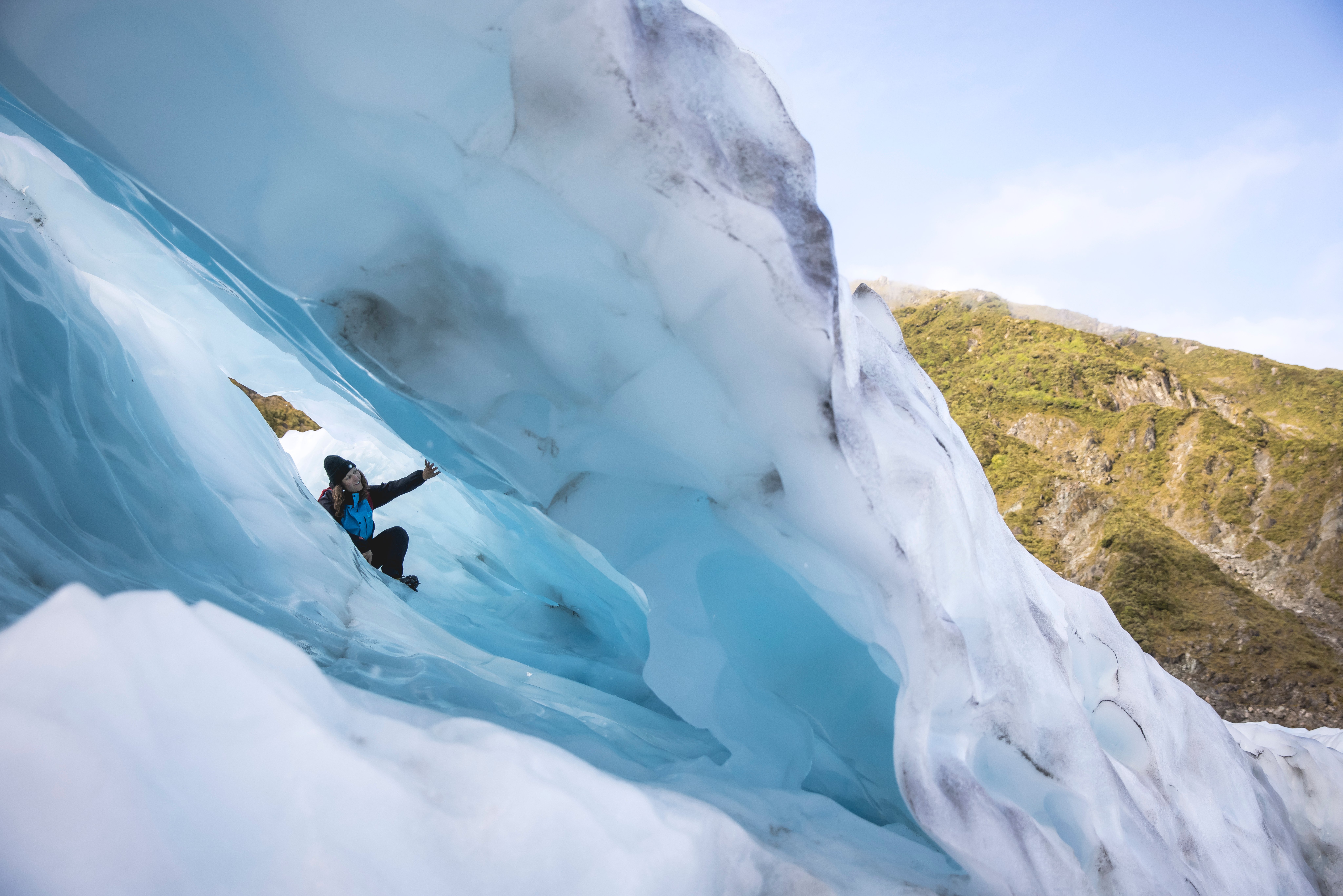 Person under a glacier